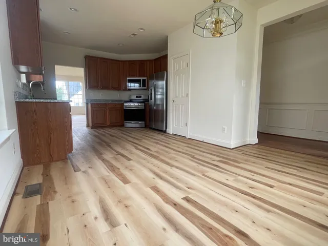 a view of a kitchen with a sink