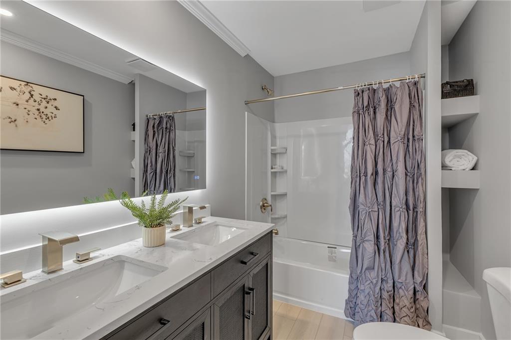 601 Center Avenue Pittsburgh, PA 15202 - Photo 18 of 48 a bathroom with a granite countertop sink a toilet and shower