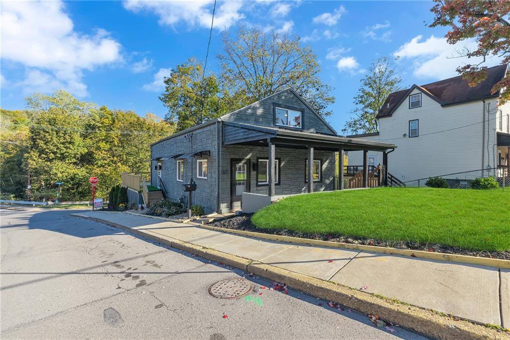 601 Center Avenue Pittsburgh, PA 15202 - Photo 2 of 48 a front view of a house with a garden and yard