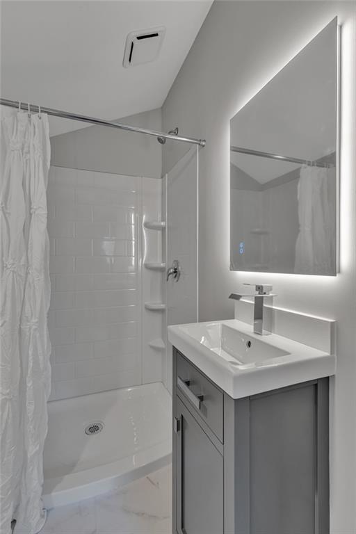 601 Center Avenue Pittsburgh, PA 15202 - Photo 22 of 48 a bathroom with a shower a sink and a mirror
