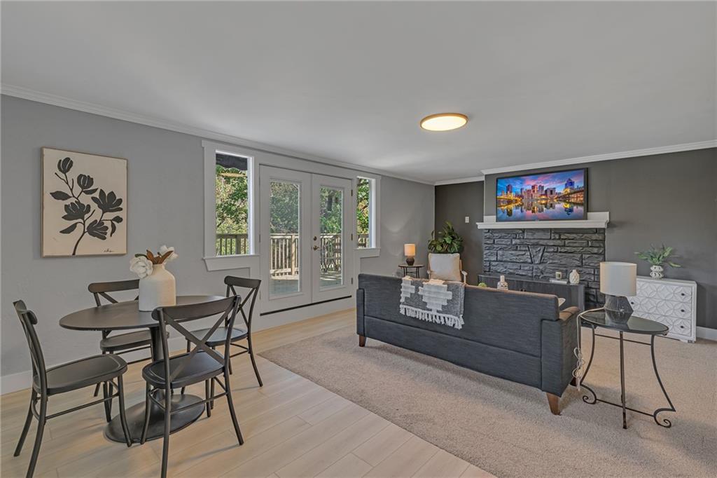 601 Center Avenue Pittsburgh, PA 15202 - Photo 5 of 48 a living room with furniture a fireplace and a flat screen tv