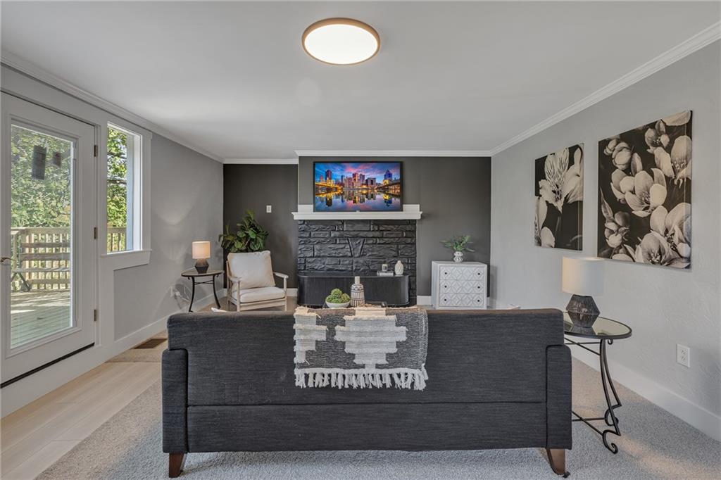 601 Center Avenue Pittsburgh, PA 15202 - Photo 7 of 48 a living room with furniture and a fireplace