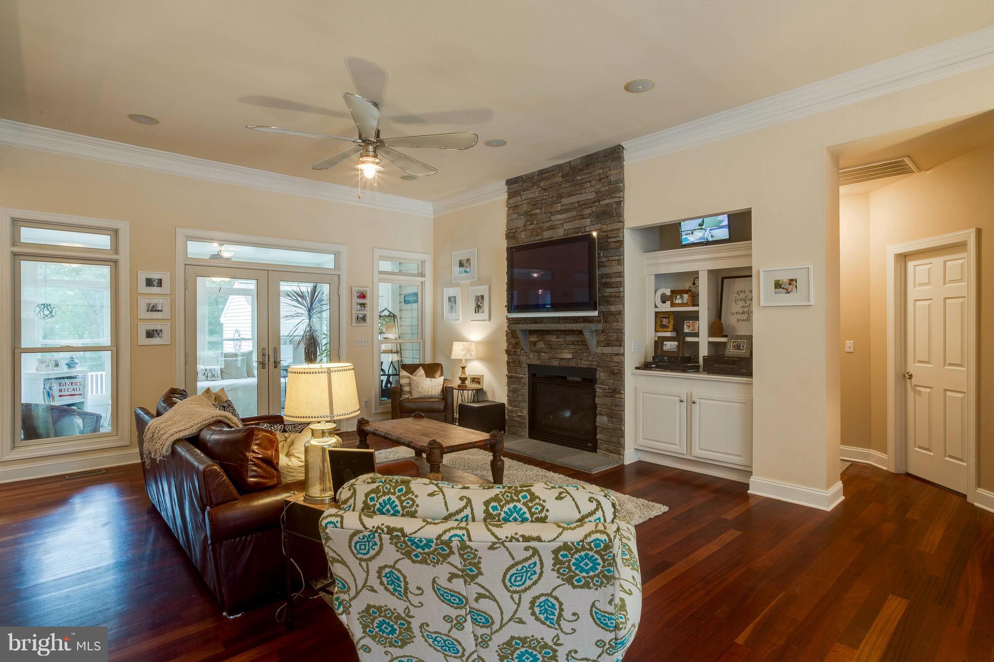 472 McCarty Road Fredericksburg, VA 22405 - Photo 6 of 30 Stacked stone fireplace & built in cabinetry