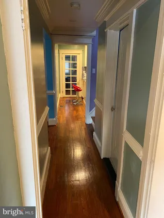 a view of entryway with wooden floor