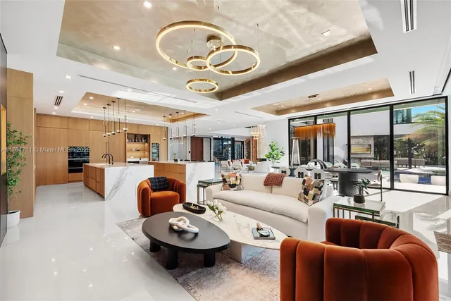 a kitchen with stainless steel appliances kitchen island granite countertop a refrigerator and a stove