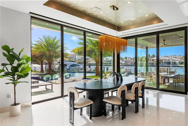 a spacious bedroom with a bed and large window