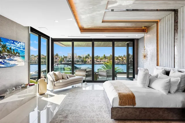 a kitchen with a sink a counter top space and stainless steel appliances