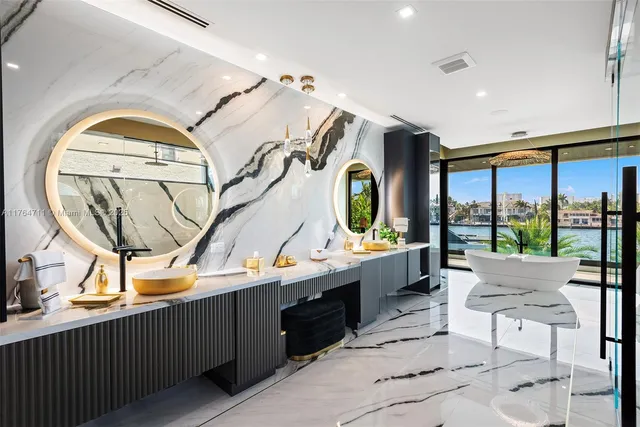 a view of a house with swimming pool and sitting area