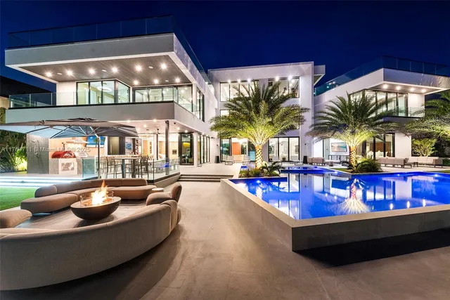 a living room with furniture and large window