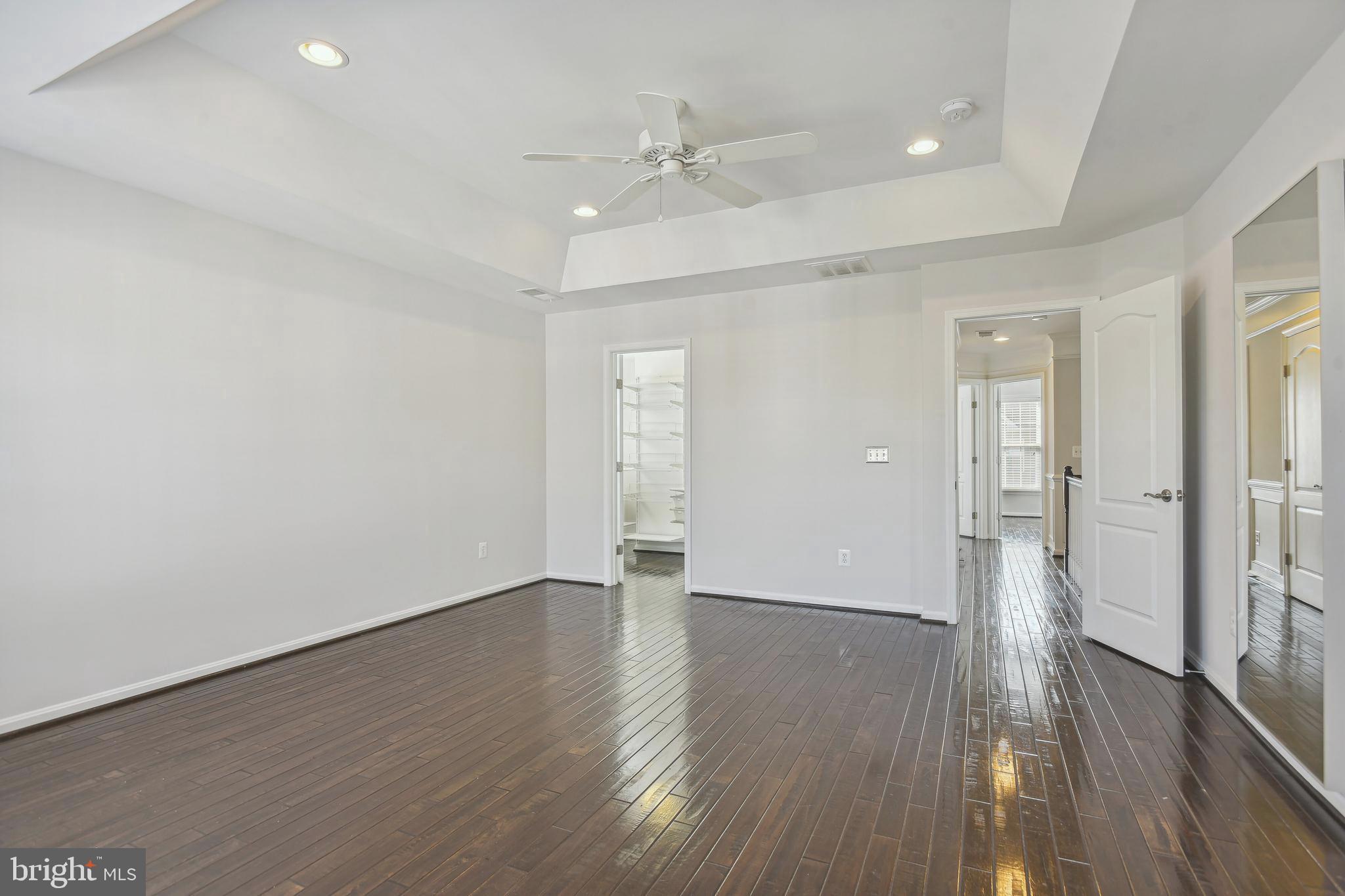 22652 Gray Falcon Square Ashburn, VA 20148 - Photo 13 of 24 wooden floor in an empty room with a window