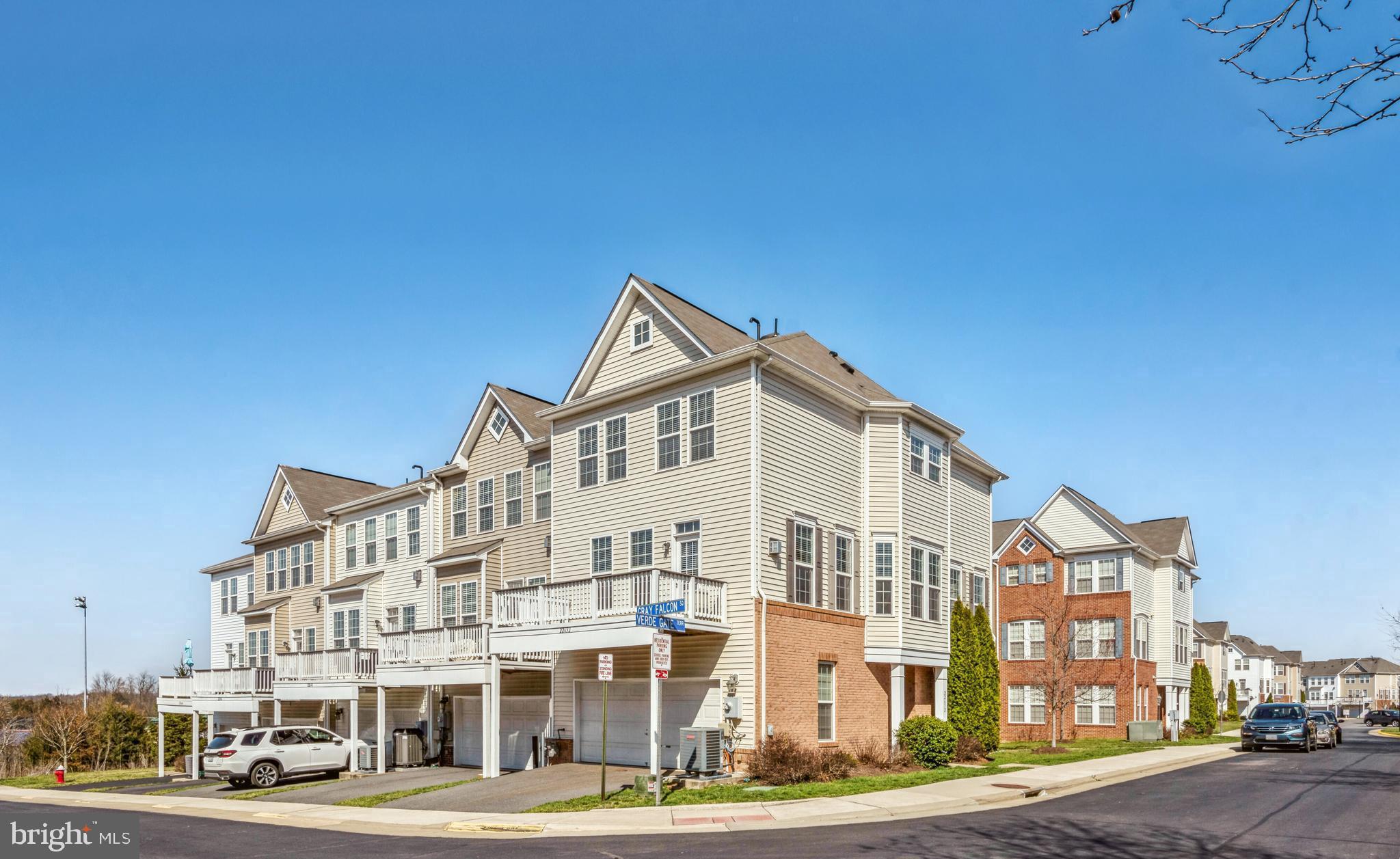 22652 Gray Falcon Square Ashburn, VA 20148 - Photo 24 of 24 a front view of a building with lot of cars and trees