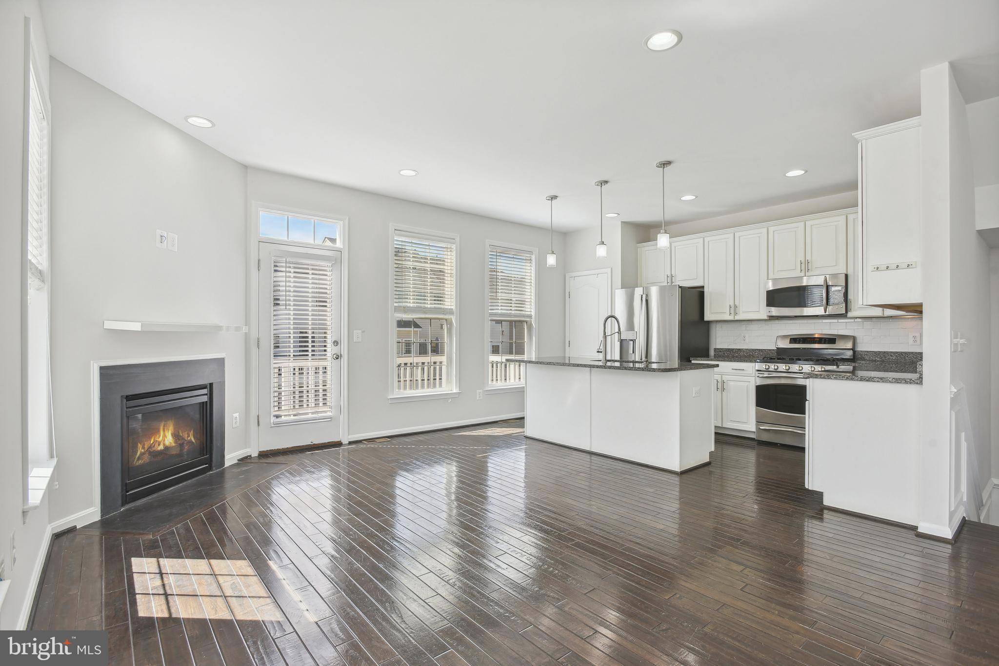 22652 Gray Falcon Square Ashburn, VA 20148 - Photo 5 of 24 a view of kitchen with granite countertop stainless steel appliances stove refrigerator and cabinets