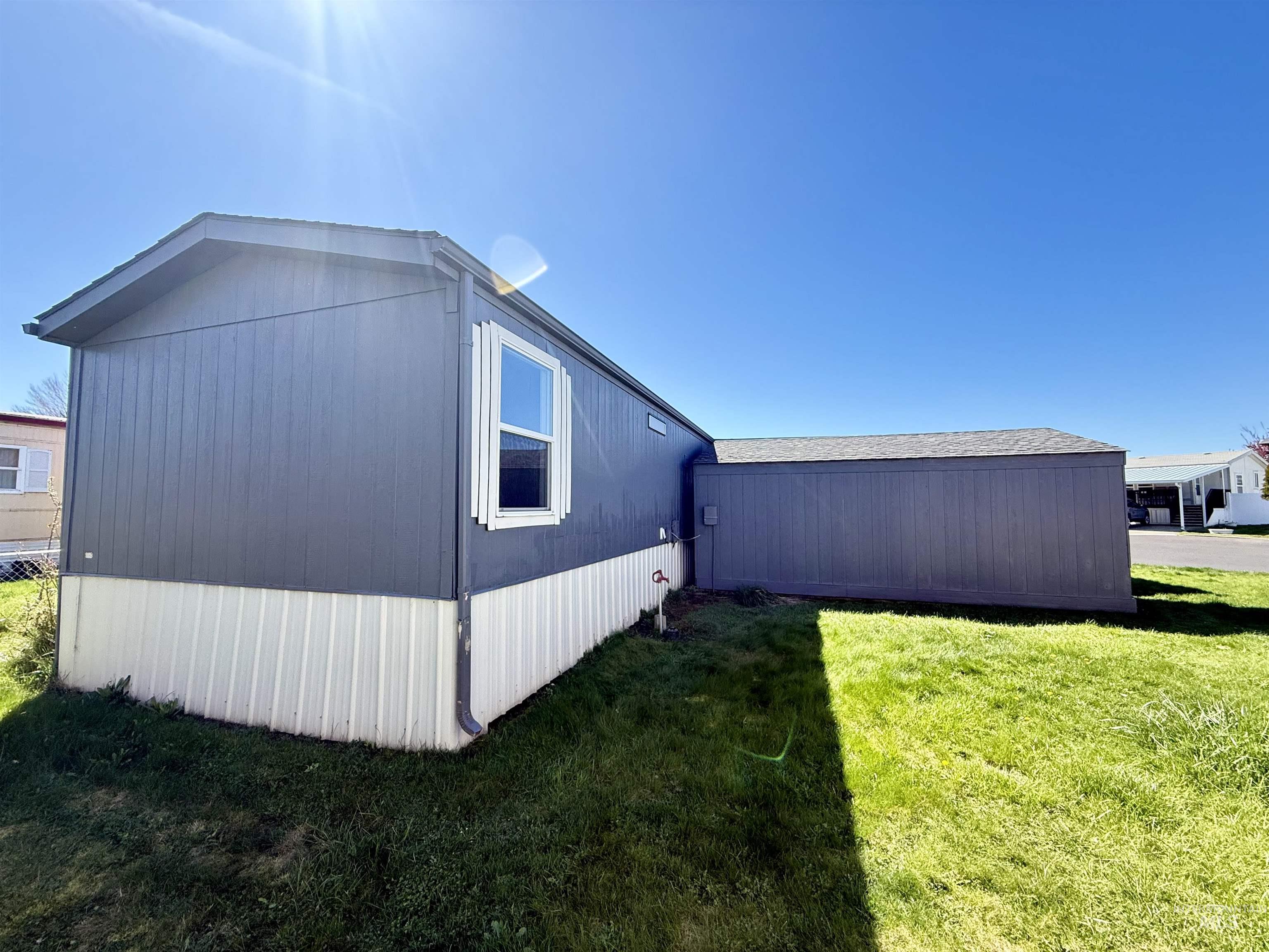 2015 6th Avenue, Unit 321 Clarkston, WA 99403 - Photo 26 of 34 View of side of home featuring a lawn