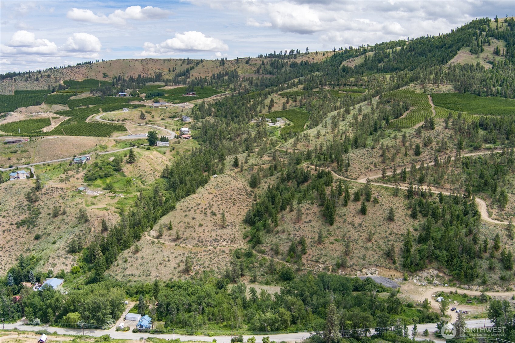 35 Watchman Lane Wenatchee, WA 98801 - Photo 2 of 36 an aerial view of residential houses with outdoor space and trees