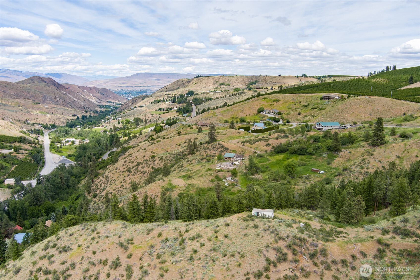 35 Watchman Lane Wenatchee, WA 98801 - Photo 10 of 36 a view of a field with mountains in the background
