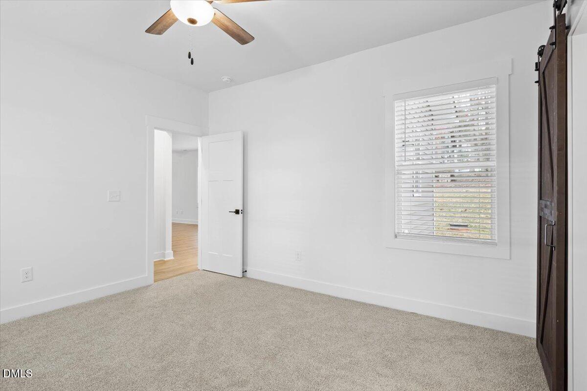 929 Jasmine Road Fuquay-Varina, NC 27526 - Photo 14 of 27 a view of an empty room with a window