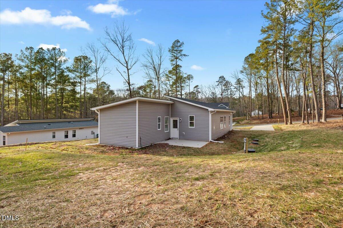 929 Jasmine Road Fuquay-Varina, NC 27526 - Photo 24 of 27 a house with trees in the background