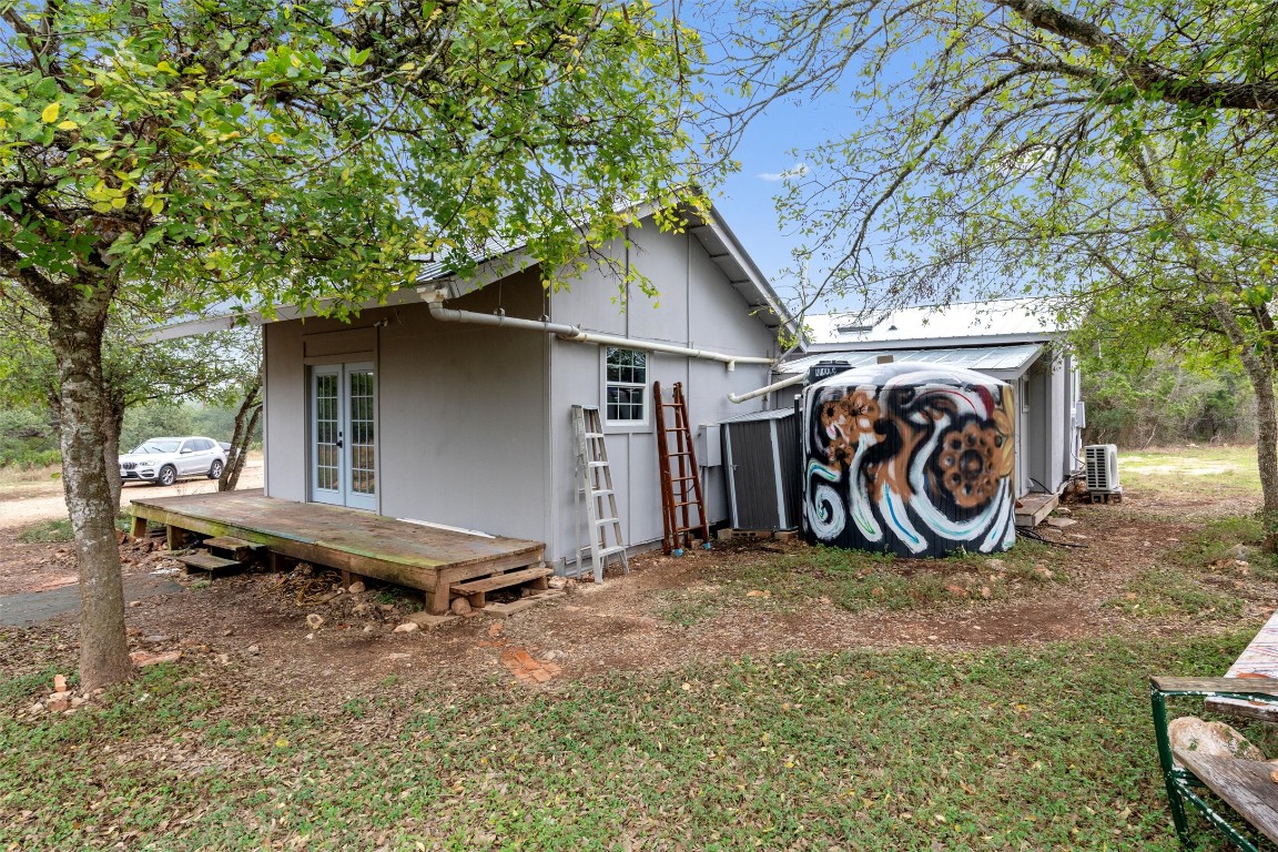 1100 High Road San Marcos, TX 78666 - Photo 21 of 36 a backyard of a house with bicycles parked and a tree