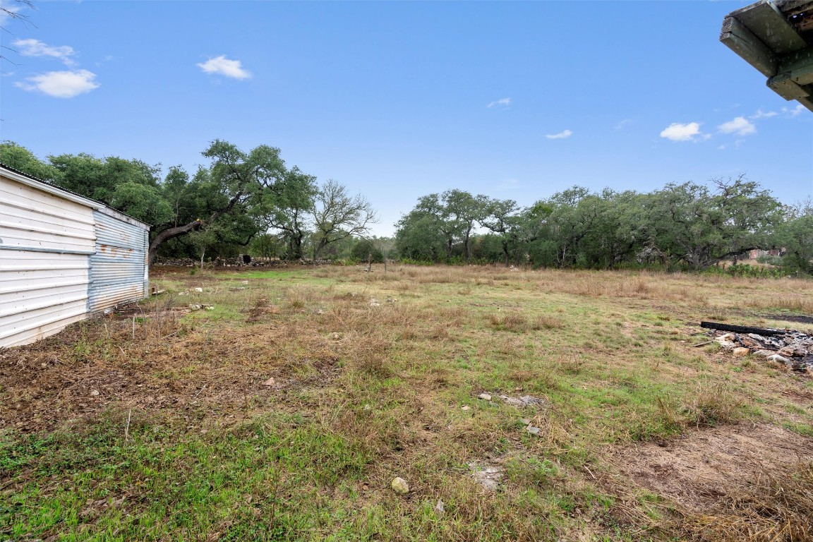 1100 High Road San Marcos, TX 78666 - Photo 29 of 36 a view of a field with trees in the background