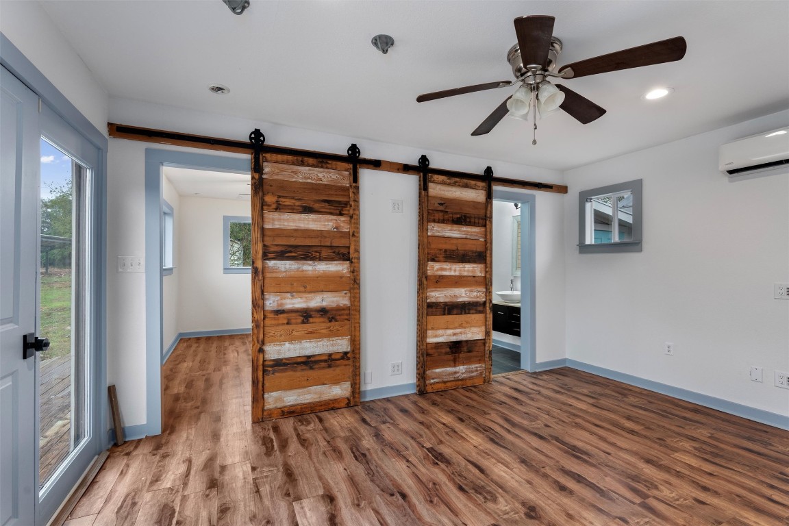 1100 High Road San Marcos, TX 78666 - Photo 8 of 36 a view of room with wooden floor and window