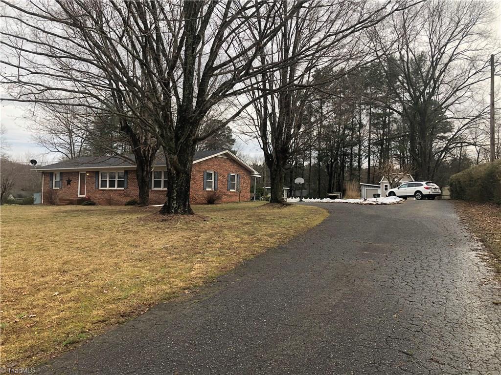 156 Mills Road Mount Airy, NC 27030 - Photo 1 of 29 Welcome to 156 Mills Rd Mt Airy, Paved Drive, circle drive, work shop with power and water, storage building, in ground pool. Basement has upstairs and outside entrance, 2 bedrooms, kitchen, laundry Rm, full bath and living room.