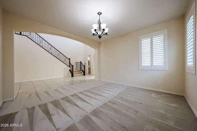 a view of a livingroom with furniture and a kitchen
