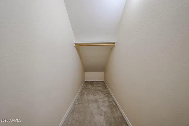a view of empty room with a ceiling fan