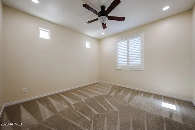 a view of a backyard with sitting area