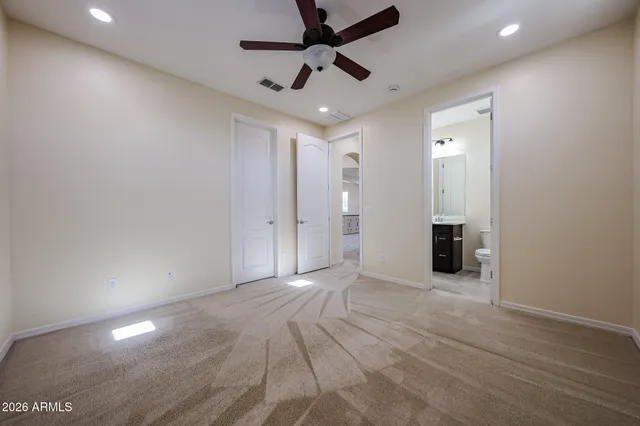 a view of a livingroom with wooden floor and a backyard space