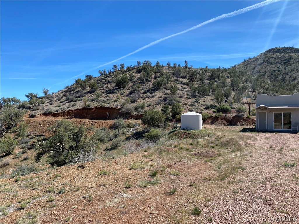 9095 Elliott Ridge Road Kingman, AZ 86401 - Photo 26 of 54 a view of a dry yard with wooden fence