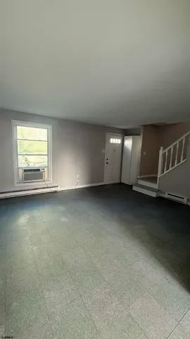 an empty room with a fireplace