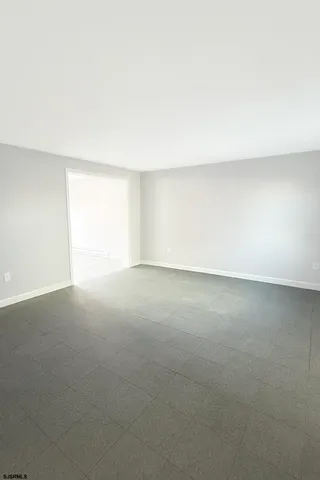 a view of an empty room and a window
