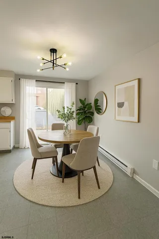 a dining room with furniture and window