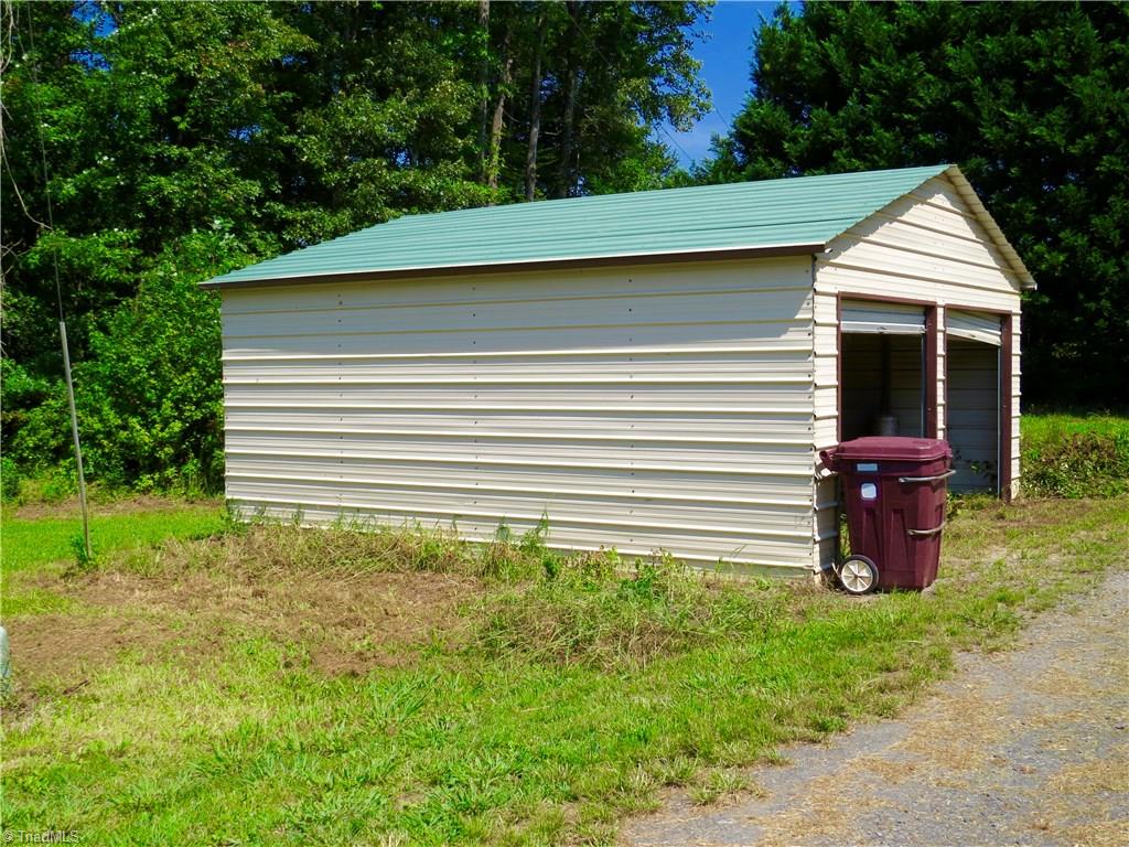 1170 Guerrant Springs Road Ruffin, NC 27326 - Photo 14 of 22 Detached 2 car garage, note one of the doors needs repair, garage sold as-is