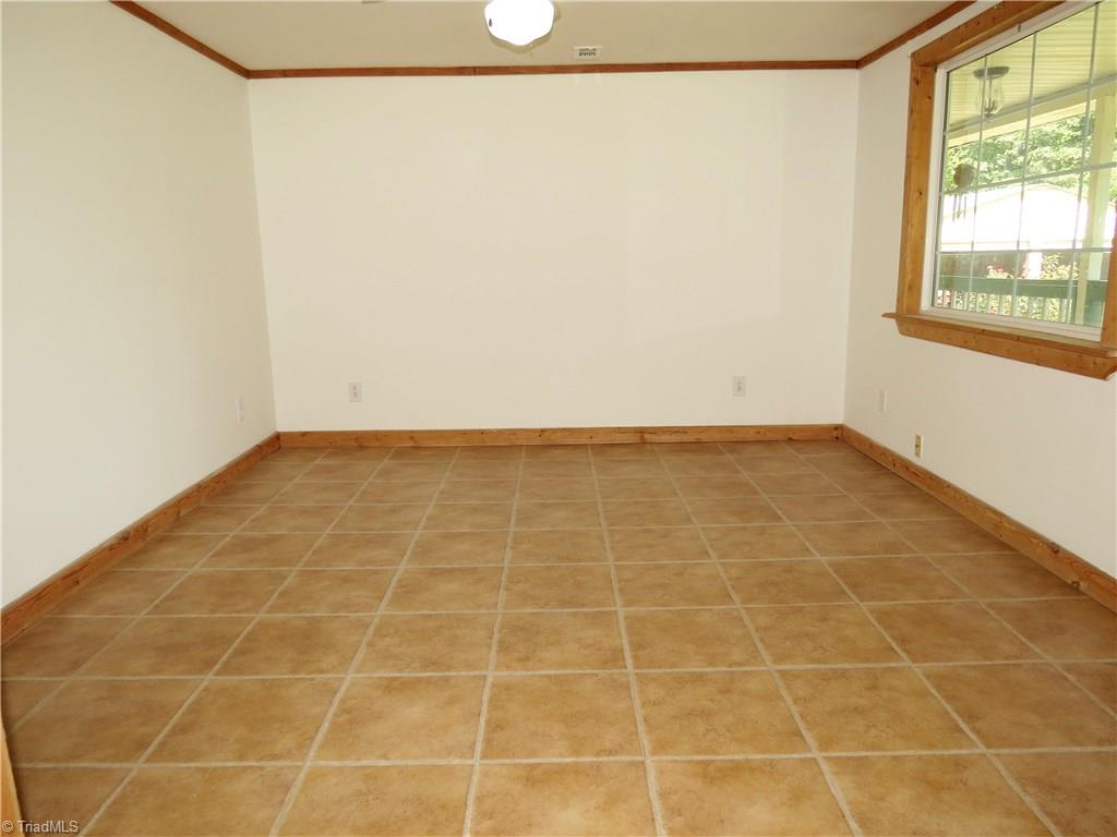 1170 Guerrant Springs Road Ruffin, NC 27326 - Photo 4 of 22 Large living room has large picture window with a great view.