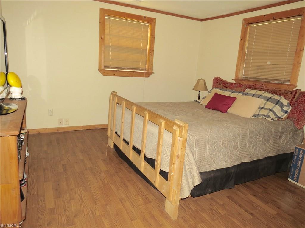 1170 Guerrant Springs Road Ruffin, NC 27326 - Photo 5 of 22 Master bedroom with gorgeous laminate flooring.