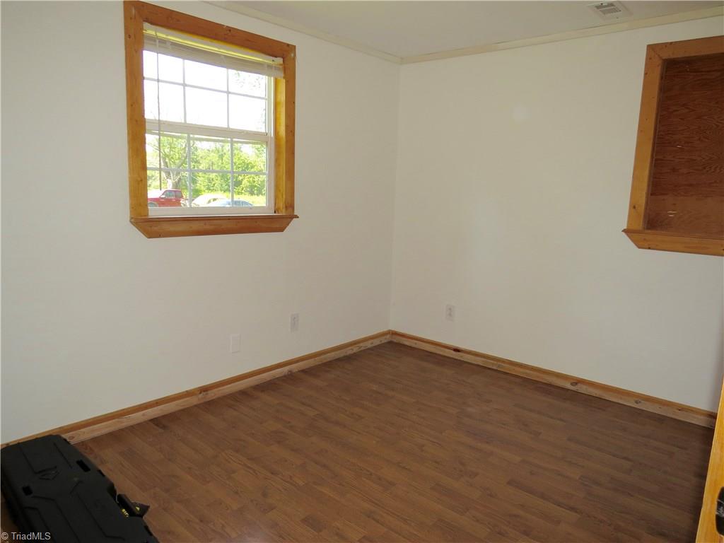 1170 Guerrant Springs Road Ruffin, NC 27326 - Photo 6 of 22 Bedroom 2 also has laminate flooring