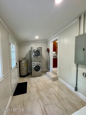 a view of a livingroom with washer and dryer