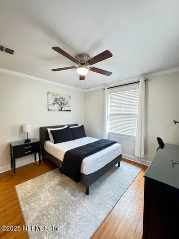 a bedroom with furniture and a rug