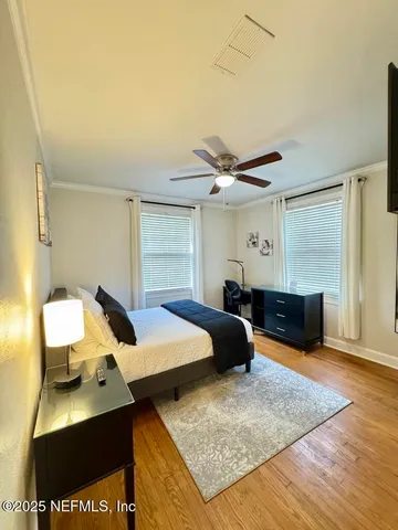 a bed room with a bed and a window