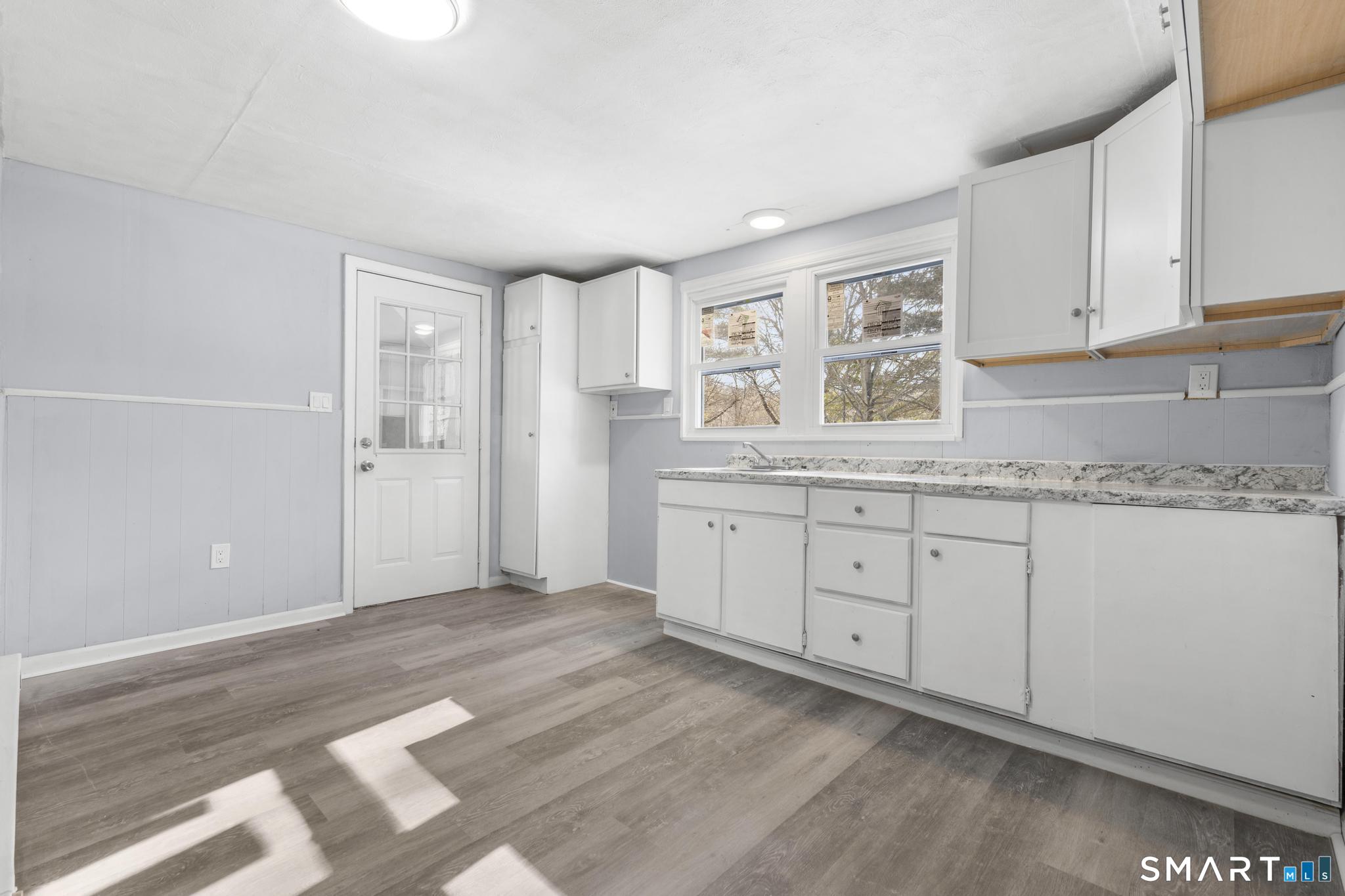 68 Thomaston Road Litchfield, CT 06791 - Photo 12 of 18 a view of a kitchen with granite countertop cabinets and a sink