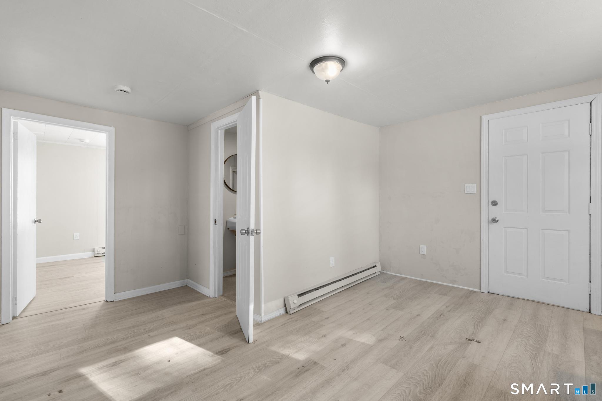 68 Thomaston Road Litchfield, CT 06791 - Photo 10 of 18 an empty room with closet and windows