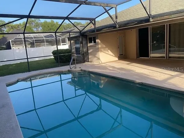 a view of a backyard with sitting area