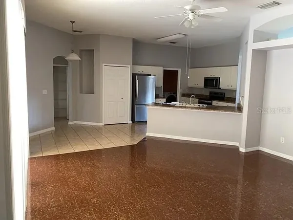 a view of a kitchen with a sink and a stove top oven