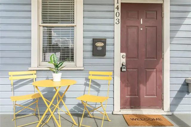 a view of a swimming pool with a chair and table