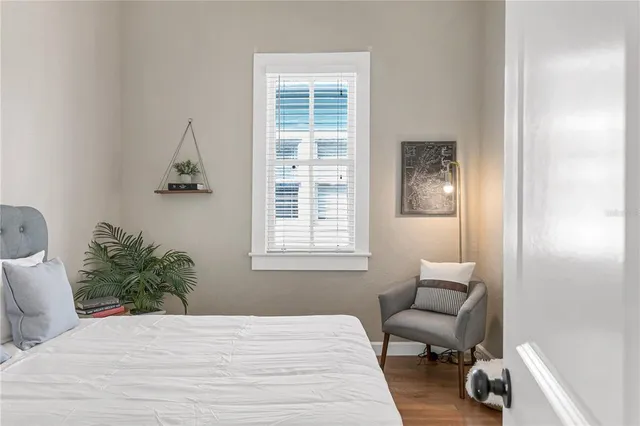 a bedroom with a bed and a chair