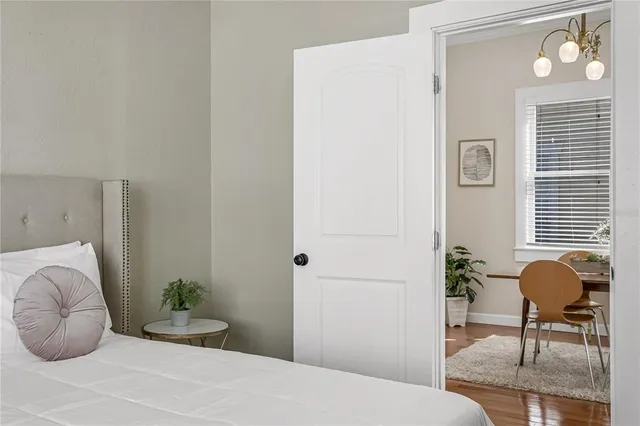 a bedroom with a bed and chair