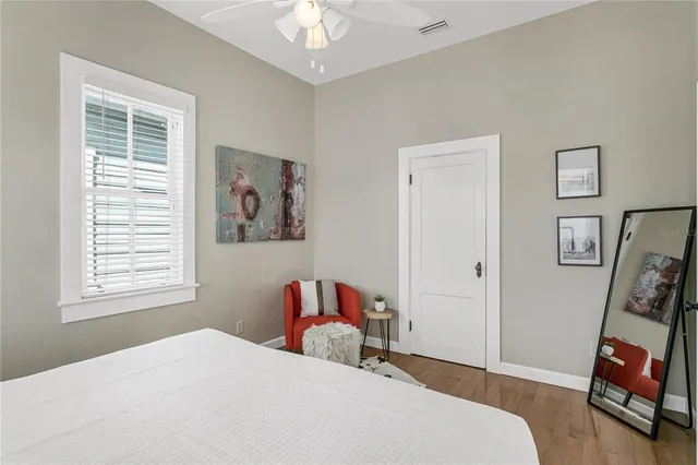 a bedroom with a bed and a window