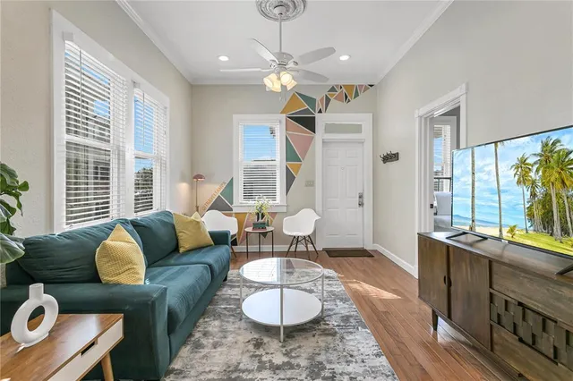a living room with furniture and a large window