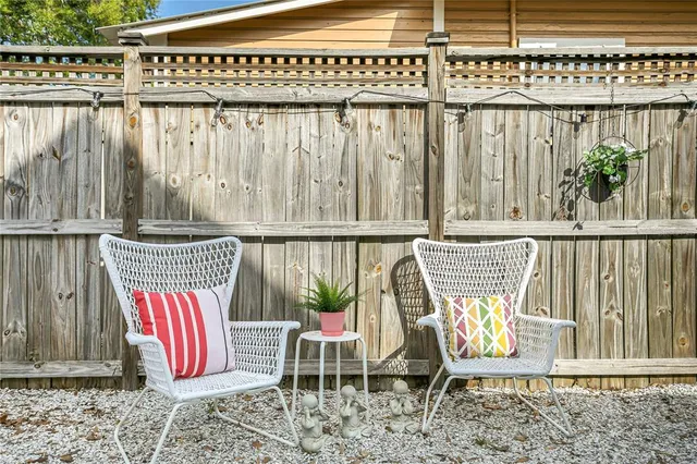 a view of a chair and table in the balcony